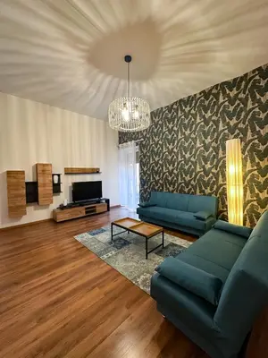 a living room with a couch and a tv at Dreamingrome in Rome