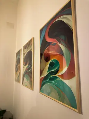 three pieces of art hanging on a wall at Dreamingrome in Rome