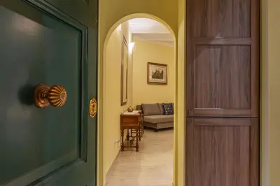 a hallway with a door leading to a living room at Domus Aureliano in Rome