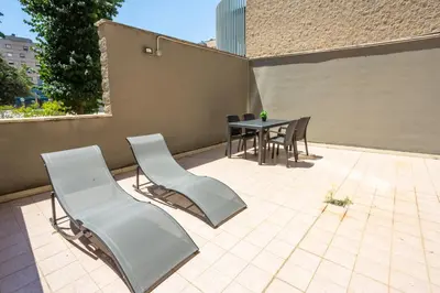a patio with a table and chairs on a patio at Eco Retreat -Sauna & Garden in Rome