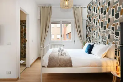 a bedroom with a bed with two teddy bears on it at Cozy Studio Steps from Metro station in Rome