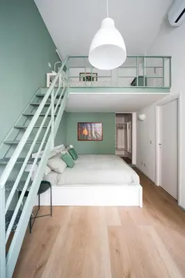 a bedroom with a bunk bed and a staircase at New lovely apartment near the metro A in Rome