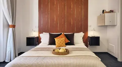 a bedroom with a bed with a basket of fruit on it at Relais Quattro Fontane in Rome