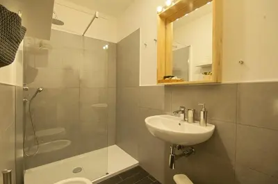 a bathroom with a sink and a shower and a toilet at Relais Quattro Fontane in Rome