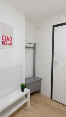 an empty room with a bench and a shelf at Aria Charme in Rome