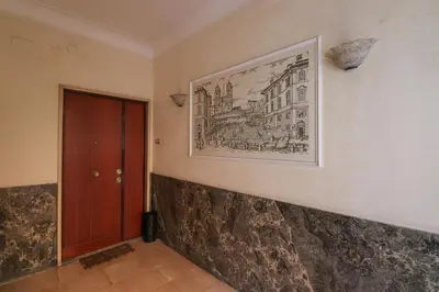 a picture hanging on a wall next to a door at Oasi di relax a Monteverde in Rome