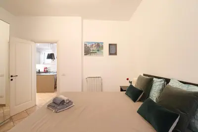 a bedroom with a large bed with green pillows at Oasi di relax a Monteverde in Rome