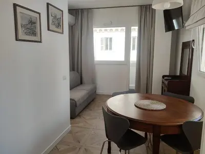 a living room with a table and a couch at Piccola Domus in Rome