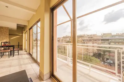 a balcony with a view of a city at Spacious and Bright 3BR Family Apartment in Rome