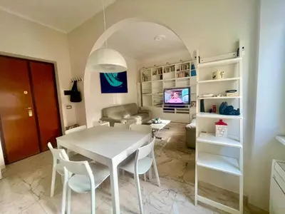 a living room with a white table and chairs at Miss Giulia Prime location flat in Rome in Rome