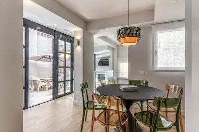 a dining room with a table and chairs at Maison Della Vite in Rome