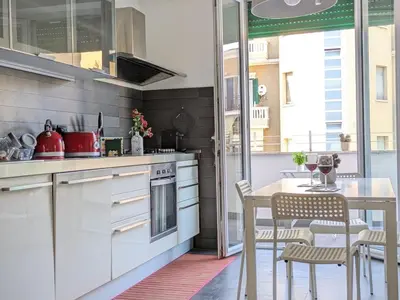 a kitchen with a table and a dining room at Interno7 in Rome
