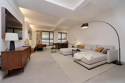 a living room with a couch and a table at Crispi Loft - My Extra Home in Rome