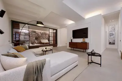 a living room with a white couch and a tv at Crispi Loft - My Extra Home in Rome
