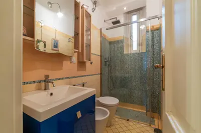 a bathroom with a sink and a shower at GuestHost - Pretty Apartment near Musei Vaticani in Rome