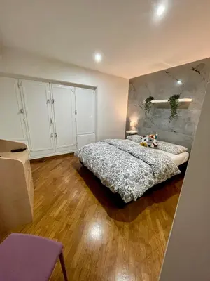 a bedroom with a large bed and a wooden floor at Lovely Apartment at Saint Peter's Square Vatican in Rome