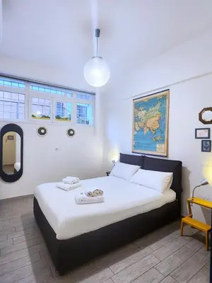 a bedroom with a large bed in a room at Sanpietrino Home in Rome