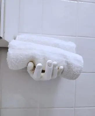 a towel holder in a bathroom with two towels at Sanpietrino Home in Rome