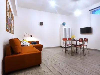 a living room with a couch and a table at Sanpietrino Home in Rome