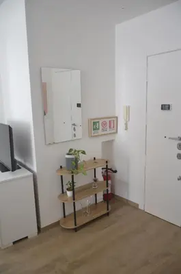 a room with a shelf with a plant on it at 50 al Vaticano House in Rome