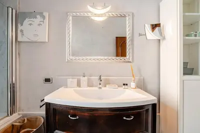 a living room with a couch and a tv at Suite Testaccio in Rome