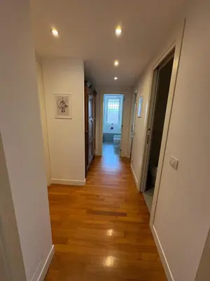 a hallway of a home with wooden floors at Roma Luxury Apartment in Rome
