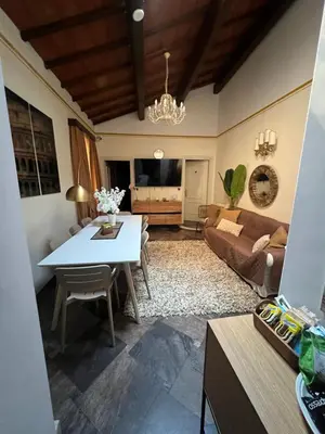 a living room with a table and a couch at S Angelo Apartment in Rome
