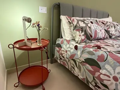a bedroom with a bed and a table with a lamp at Casa dei Parchi in Rome