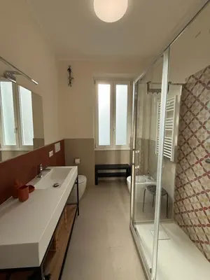 a bathroom with a shower and a sink and a toilet at Casa dei Parchi in Rome