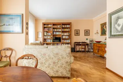 a living room with a couch and a table at Roman Retreat Near the Appian Way & Catacombs in Rome