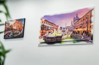 two pieces of art on a wall at Vaticano-Cornelia Luxury Home in Rome