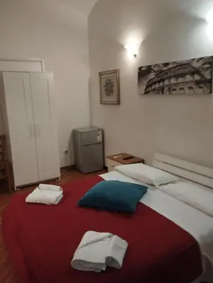 a bedroom with two beds with towels on them at Bilocale privato in Rome