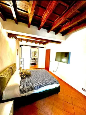 a bedroom with a bed in a room at Casa di Andrea in Trastevere in Rome