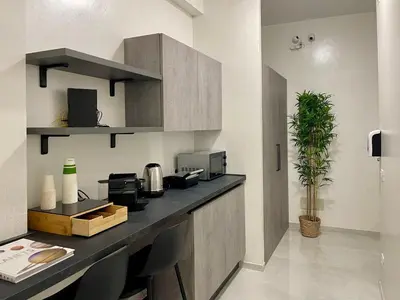 a kitchen with a counter top with at Stellar Stays in Rome