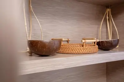 two bowls and a basket on a shelf at Spanish Steps Luxury Apartment in Rome
