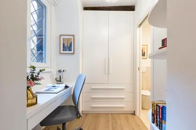 a home office with a desk and a chair at Rome As You Feel - Trastevere Nest with Secret Patio in Rome