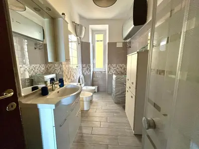 a bathroom with a sink and a toilet at Casa Dea Piramide in Rome