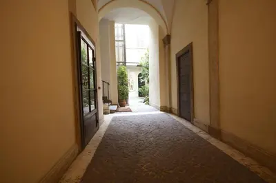 an empty hallway with a door in a building at Navona Opera Holiday House in Rome