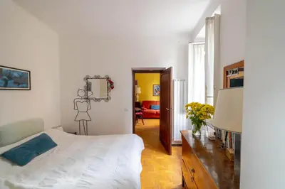 a bedroom with a bed and a tv in it at Oasi Tiberina in Rome