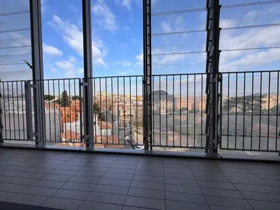 a balcony with a view of a city at Alberto's panoramic flat in Rome