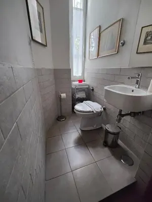 a bathroom with a toilet and a sink at Rome Center Rooms in Rome