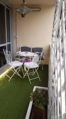 a patio with two chairs and a table on a balcony at Roma Centro appartamento in Rome