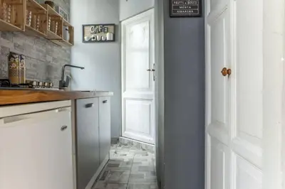 a kitchen with a sink and a counter top at The 150 Home - Homkeey Apartments in Rome