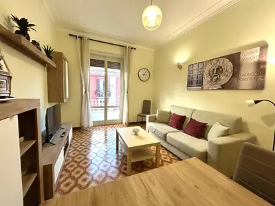 a living room with a couch and a table at Triade Home in Rome