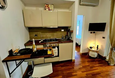 a kitchen with a sink and a stove top oven at Dream Home Cortina in Rome