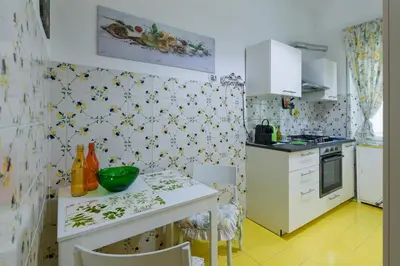 a kitchen with a table with a green bowl on it at Da Renny in Rome