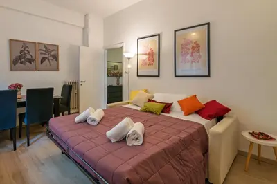 a bedroom with a large bed with pillows on it at Da Renny in Rome