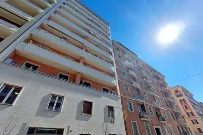 a tall building with a balcony on the side of it at 4BNB - Charming Giuliana Apartment in Rome