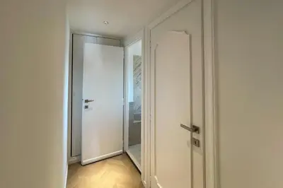 an empty corridor with a door in a room at Appartamento al Vaticano in Rome