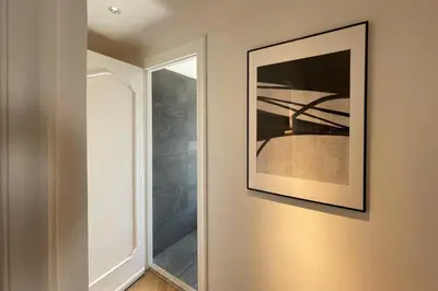 a hallway with a picture on the wall and a mirror at Appartamento al Vaticano in Rome